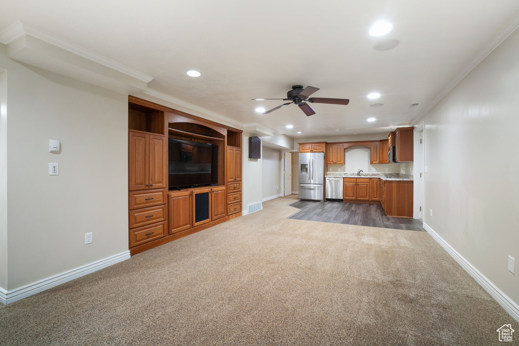Unfurnished living room featuring recessed lighting, dark colored carpet, baseboards, visible vents, and a ceiling fan