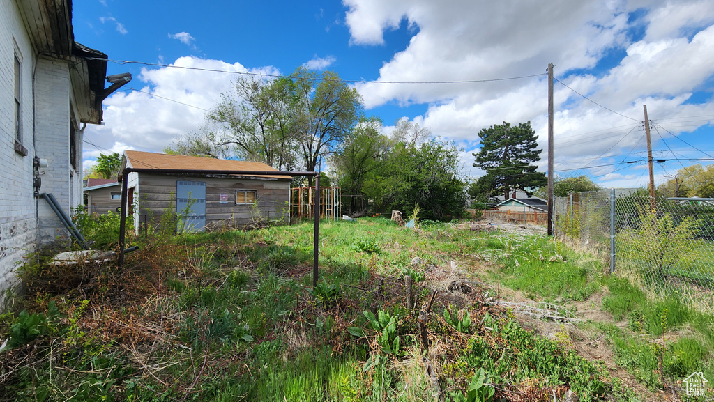 View of yard featuring fence