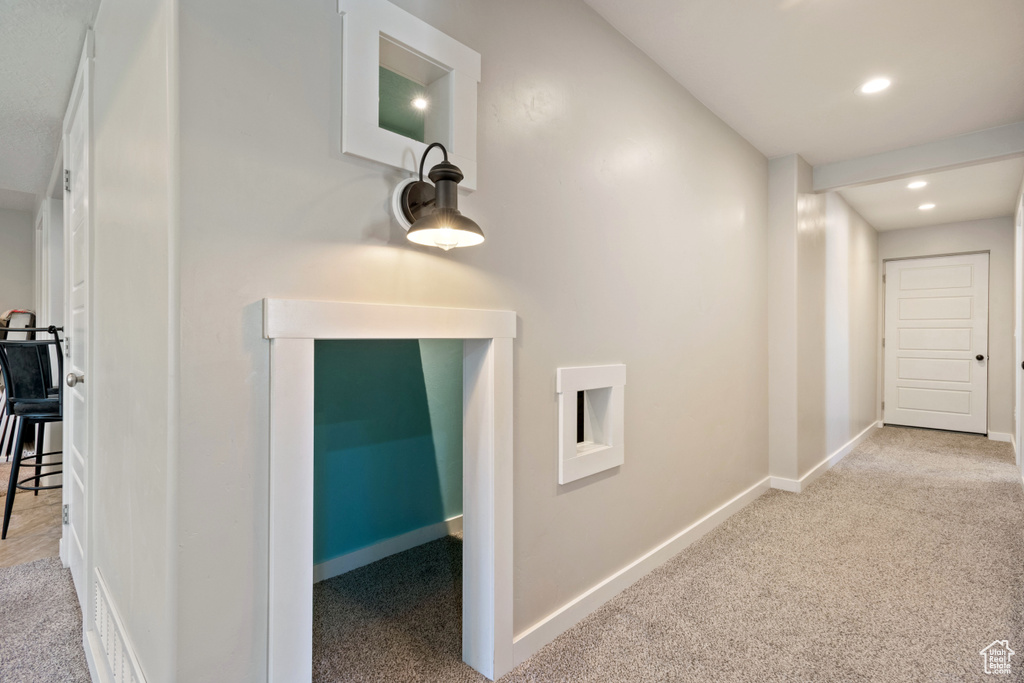 Corridor featuring recessed lighting, baseboards, visible vents, and carpet
