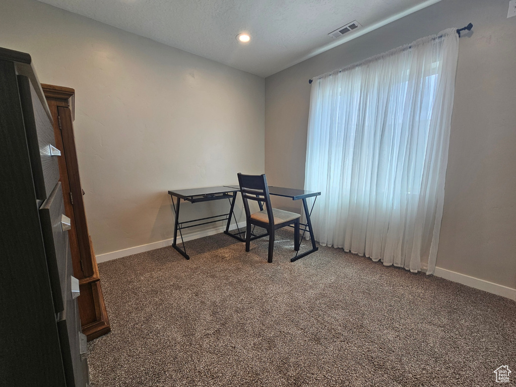 Office space with carpet flooring, recessed lighting, baseboards, and visible vents
