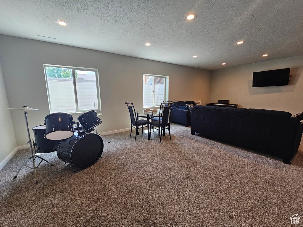 Rec room featuring recessed lighting, carpet flooring, baseboards, and a wealth of natural light