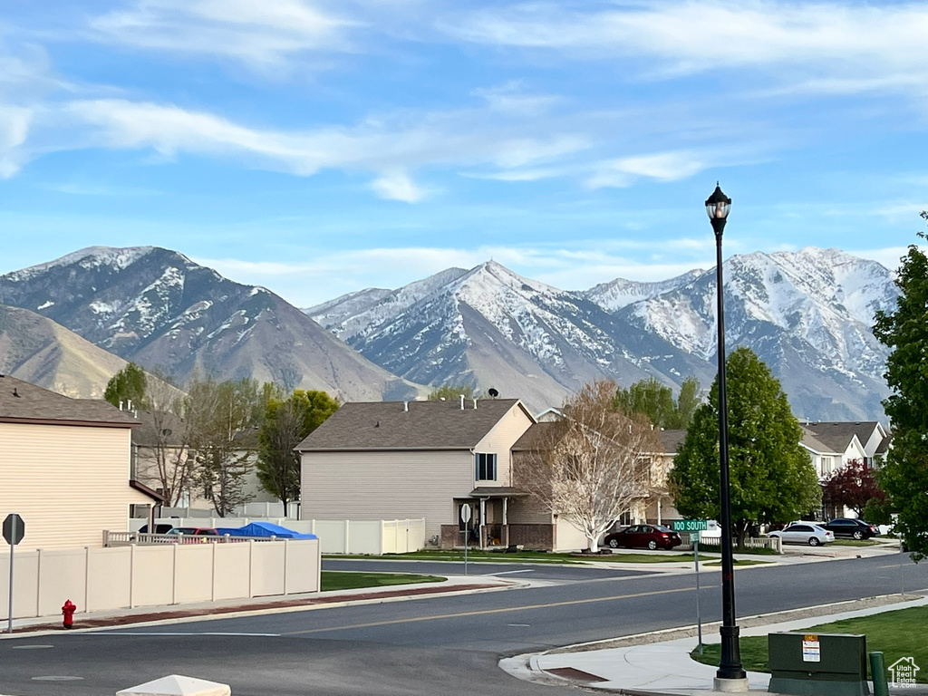 Property view of mountains with a residential view