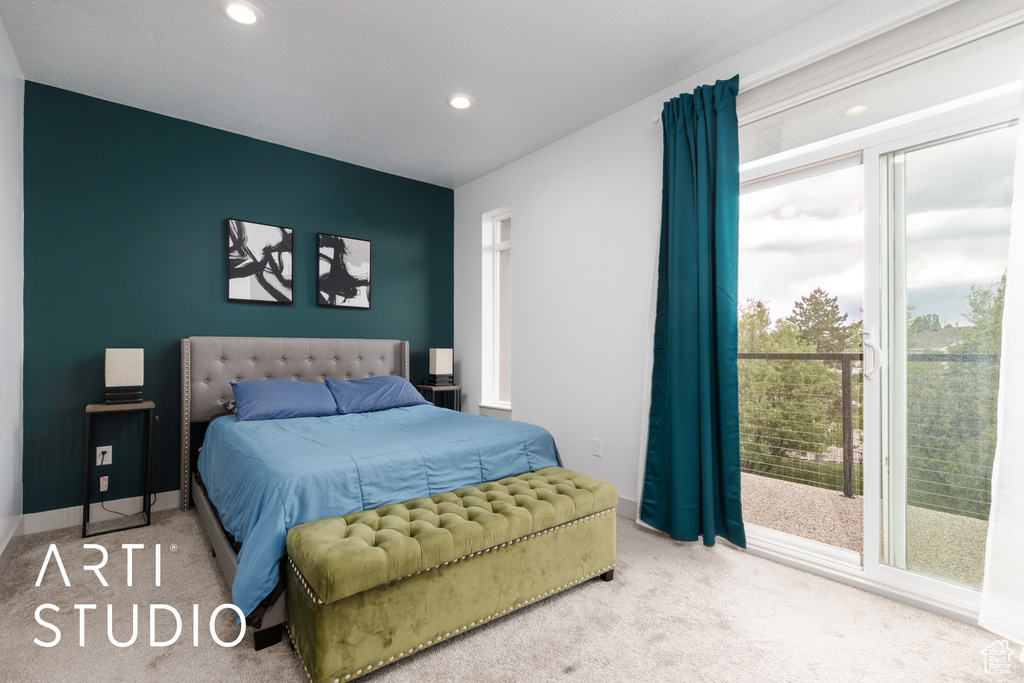 Bedroom featuring recessed lighting, multiple windows, and carpet