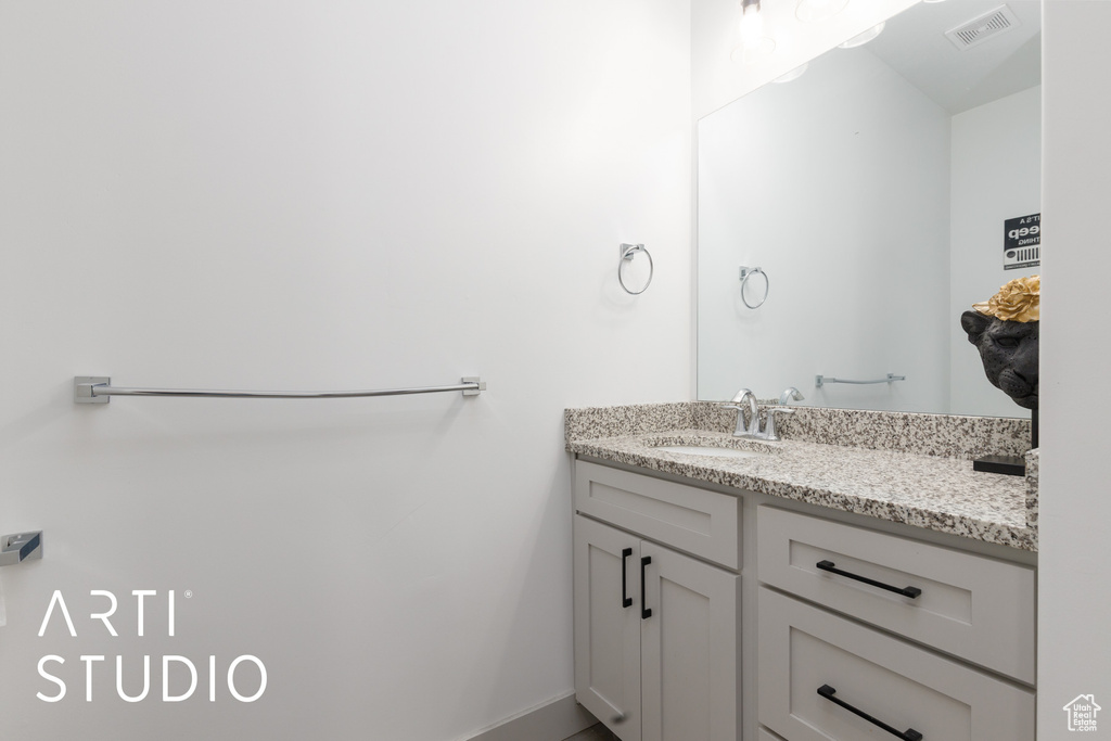 Bathroom with visible vents and vanity