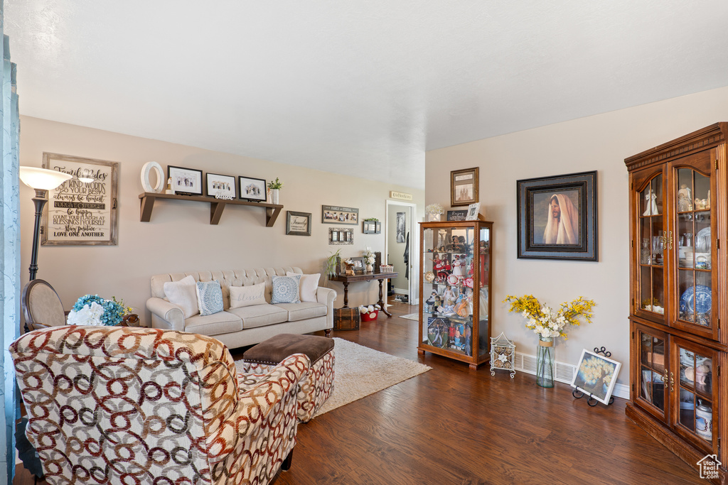 Living room featuring wood finished floors and baseboards