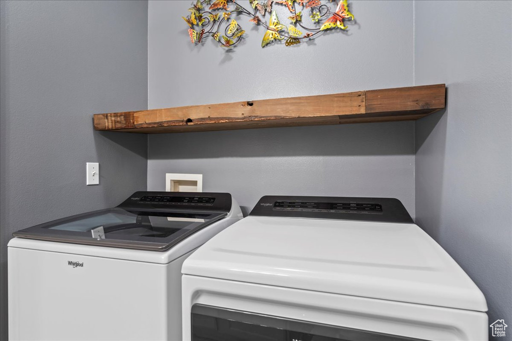 Washroom with washing machine and dryer and laundry area