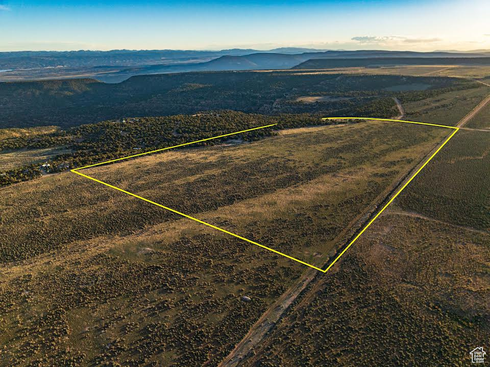 Birds eye view of property with a mountain view