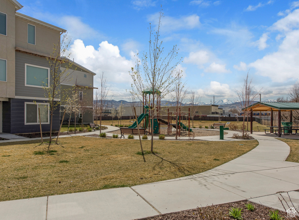 Community jungle gym with a yard and a gazebo