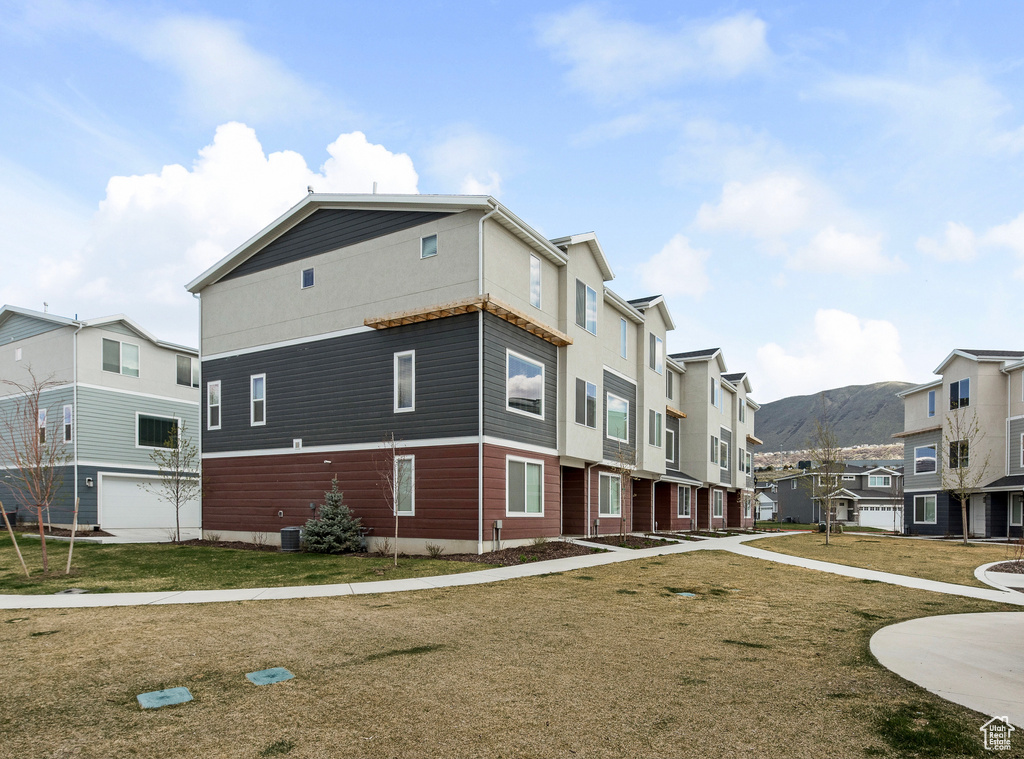 View of home\'s exterior featuring a mountain view and a residential view