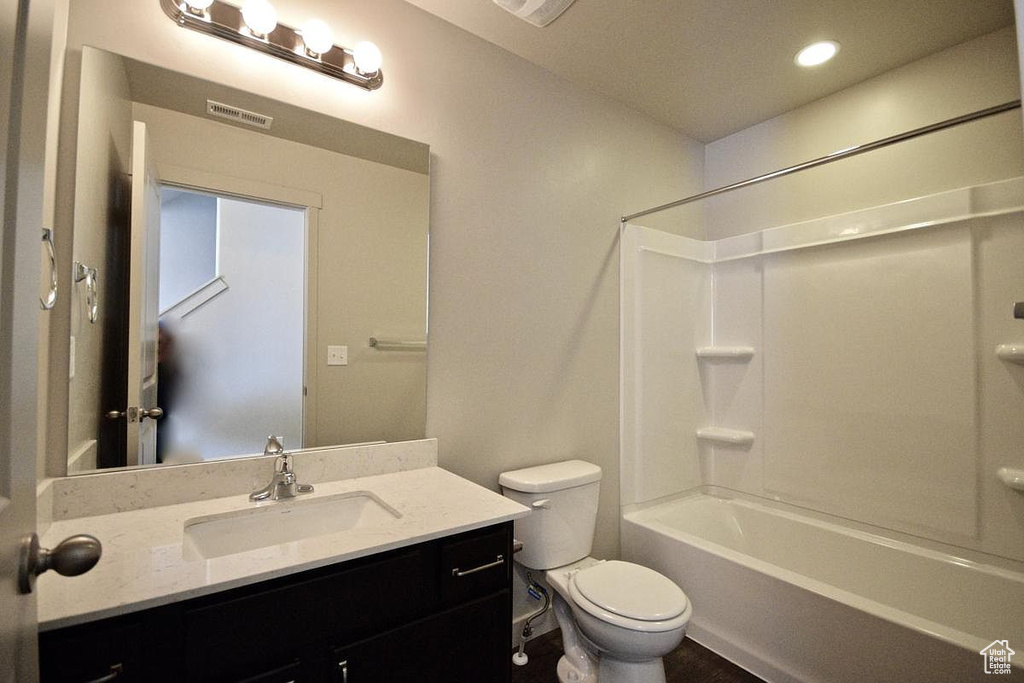 Bathroom with visible vents, toilet, recessed lighting, shower / bathing tub combination, and vanity