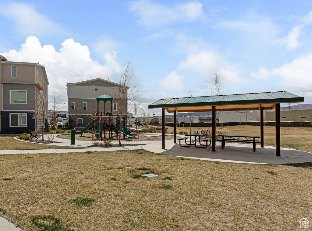 Community jungle gym with a lawn and a gazebo
