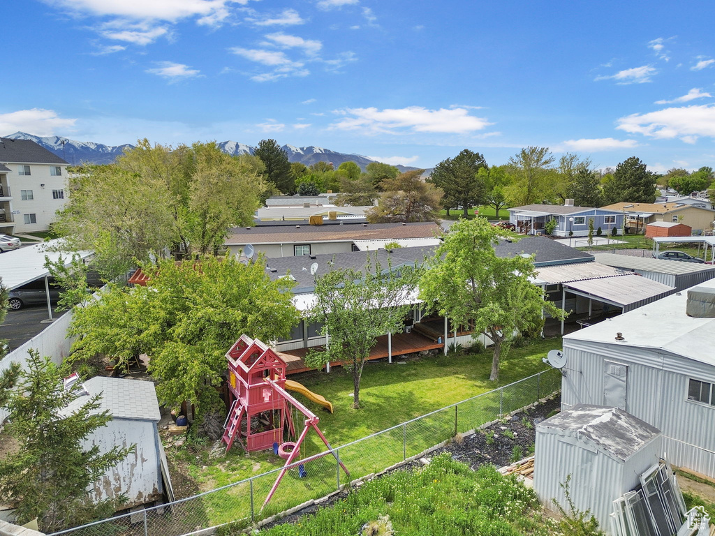 Birds eye view of property with a mountain view and a residential view