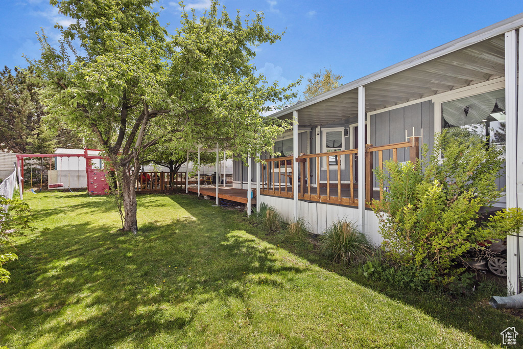 View of yard featuring a sunroom