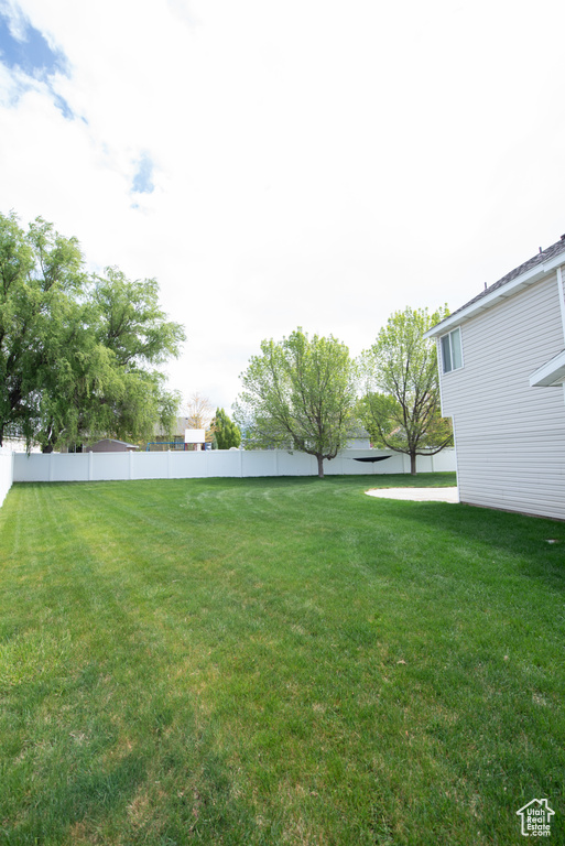 View of yard featuring fence