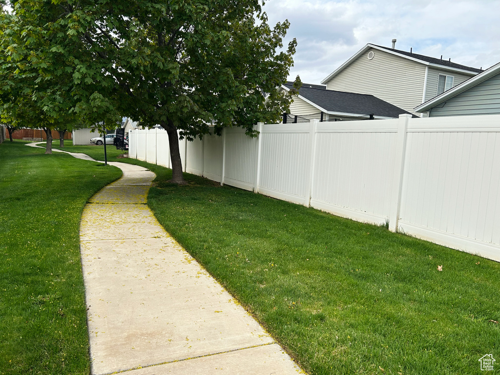 View of yard featuring fence