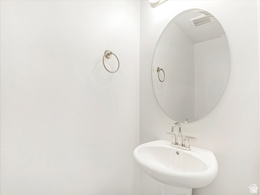 Bathroom with visible vents and a sink