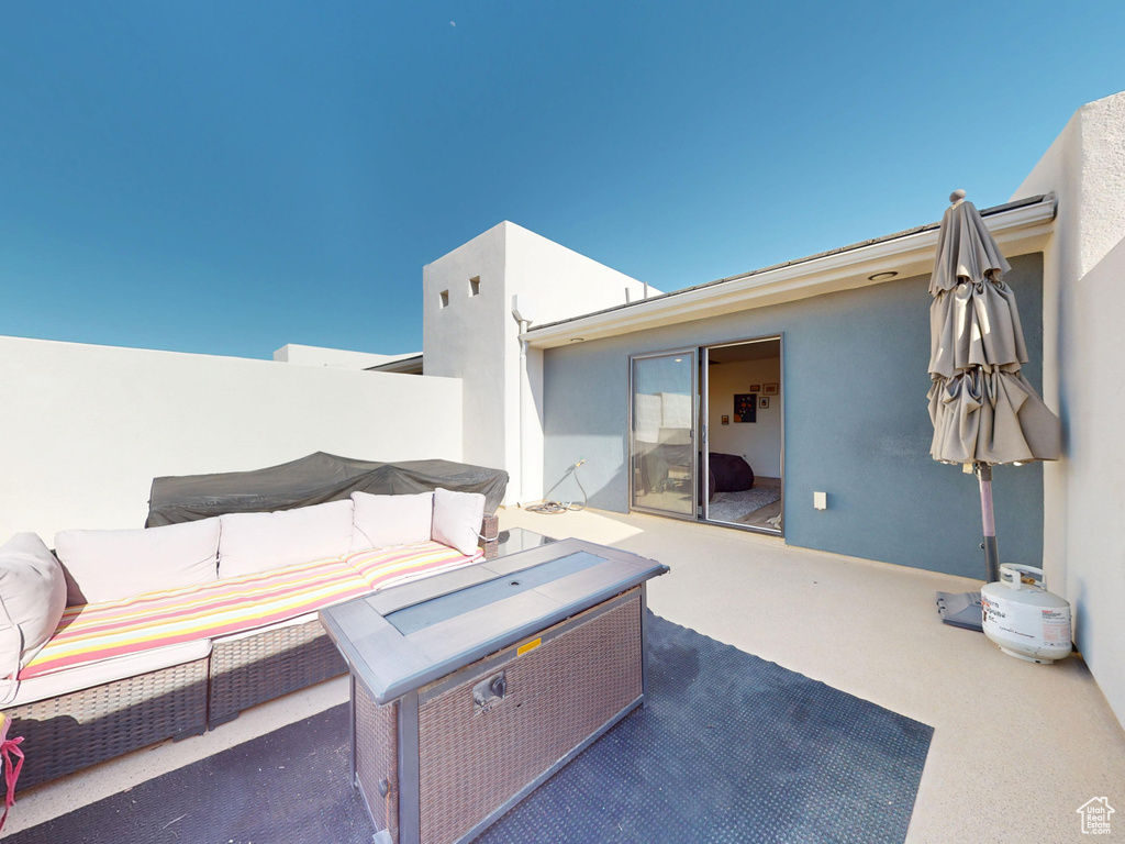View of patio featuring an outdoor hangout area