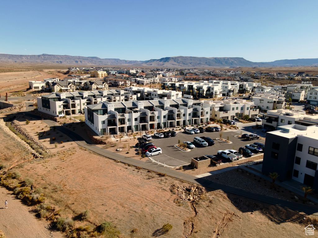 Birds eye view of property with a mountain view and a residential view