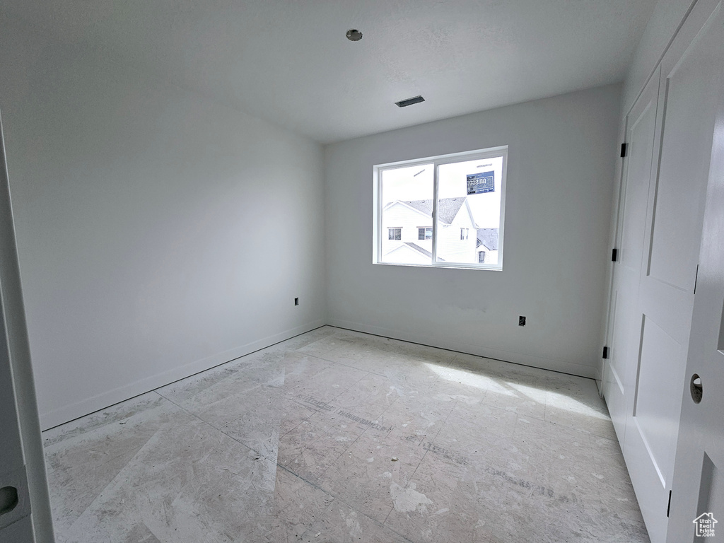 Unfurnished bedroom featuring baseboards