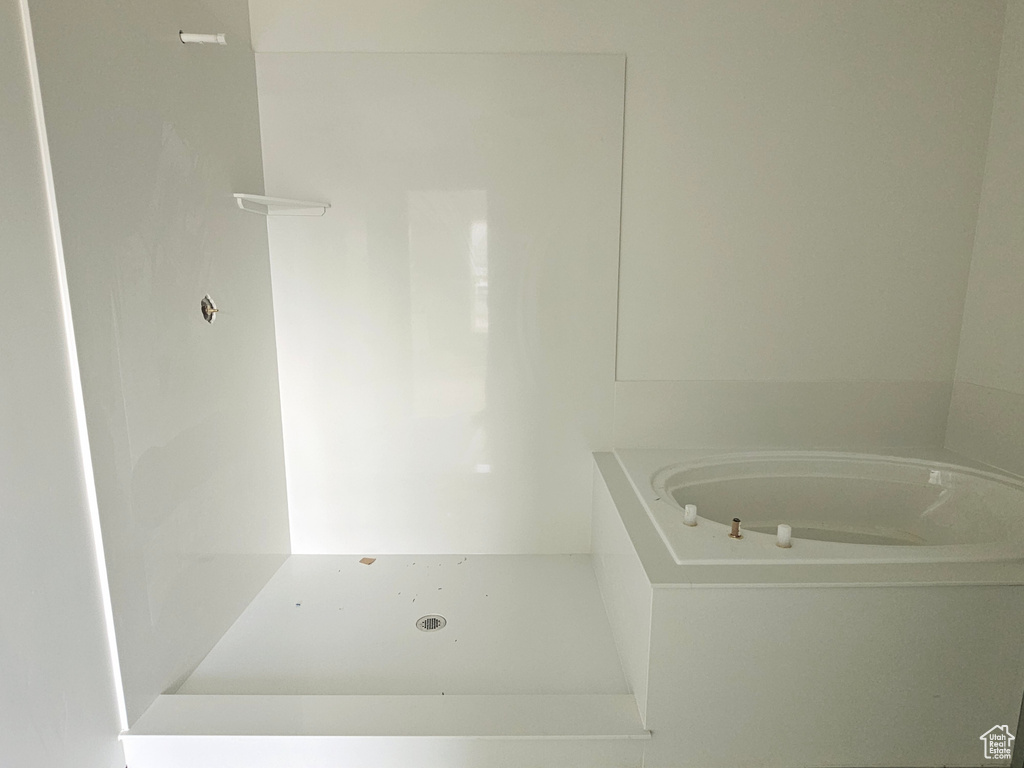 Full bathroom with a garden tub