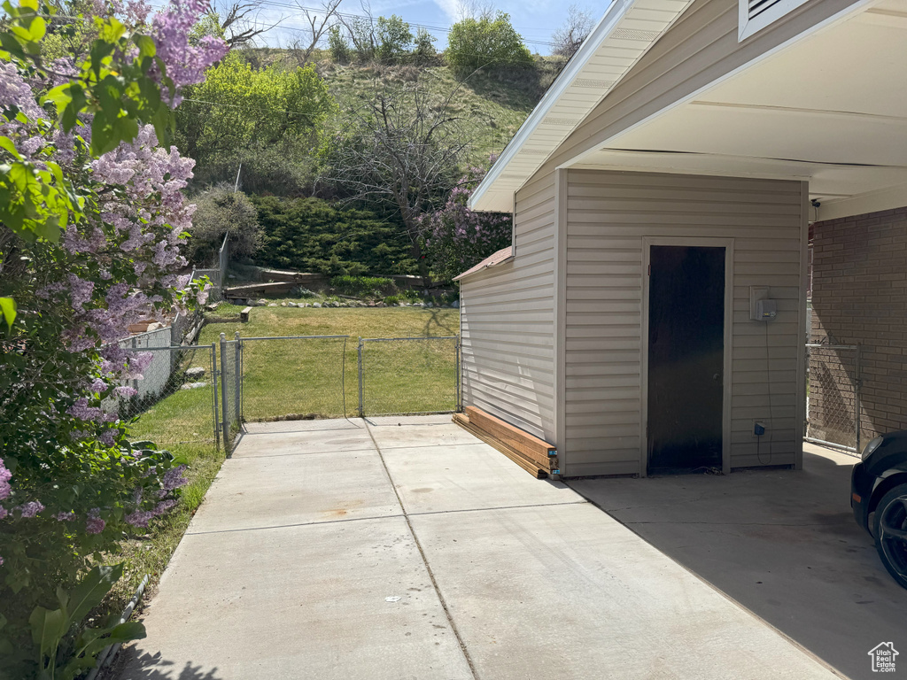View of patio featuring fence