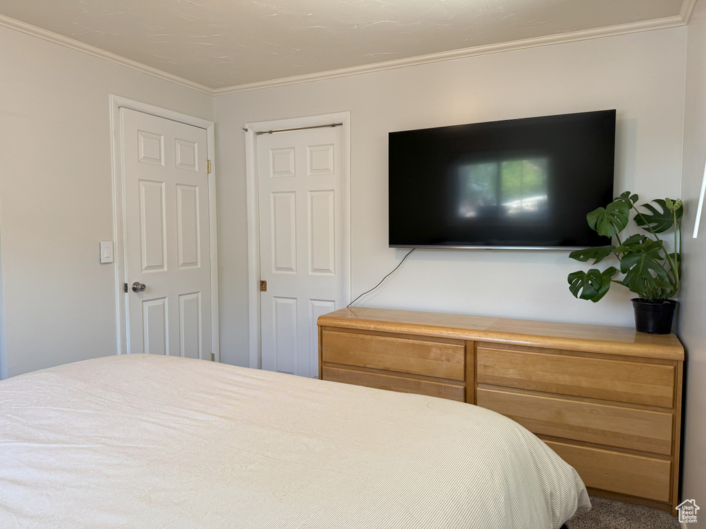 Bedroom featuring crown molding