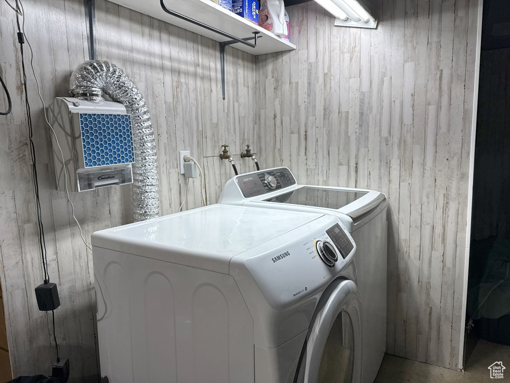 Laundry area featuring washer and clothes dryer and laundry area