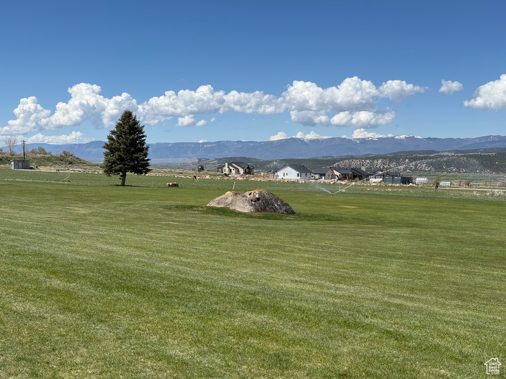 Property view of mountains featuring a rural view