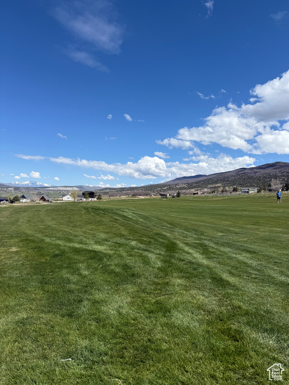 Exterior space with a mountain view, a yard, and a rural view