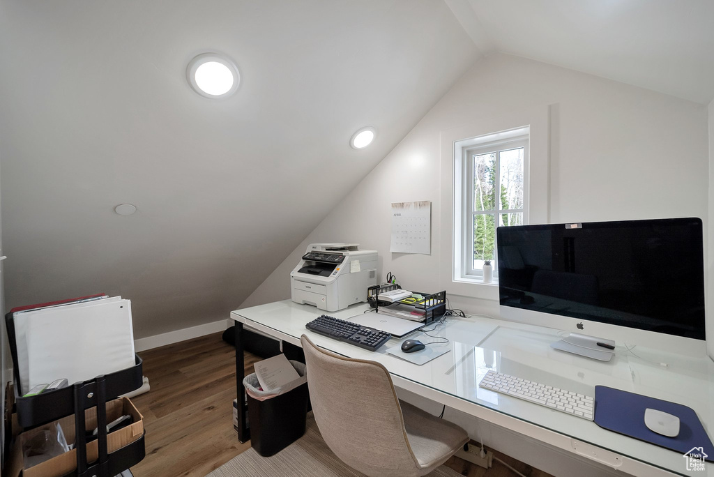 Home office with wood finished floors and lofted ceiling