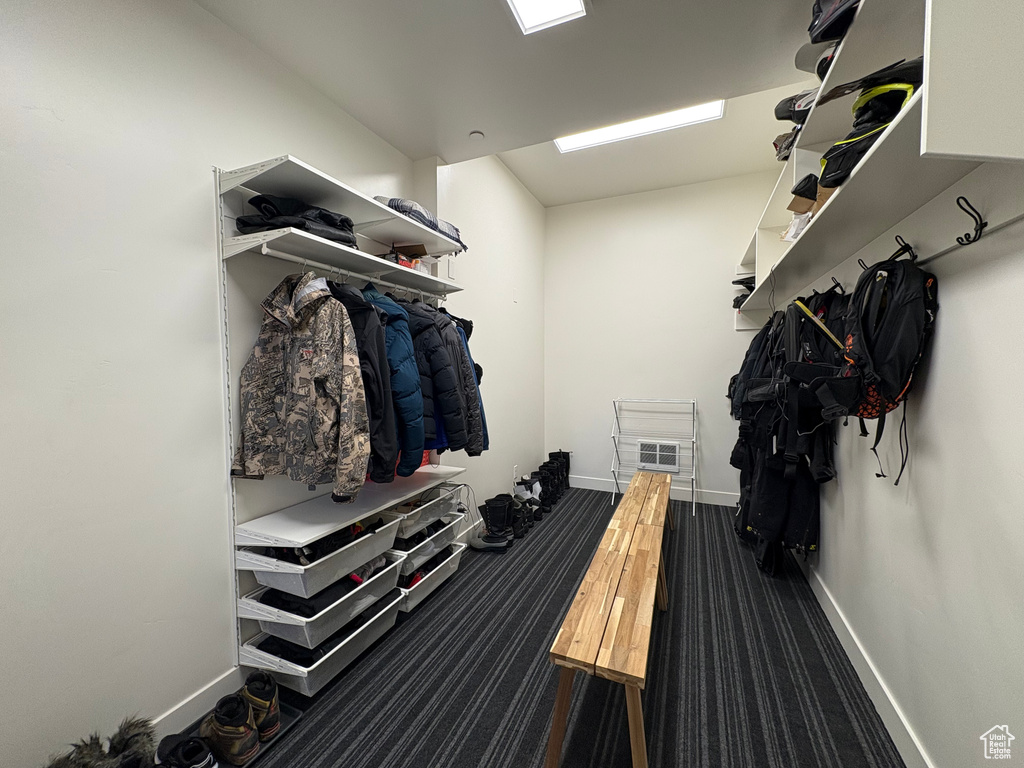 Mudroom with baseboards and carpet