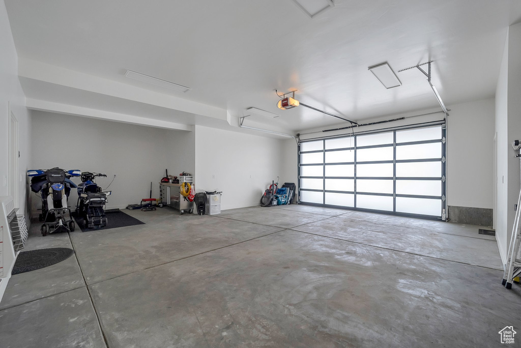 Garage featuring a garage door opener