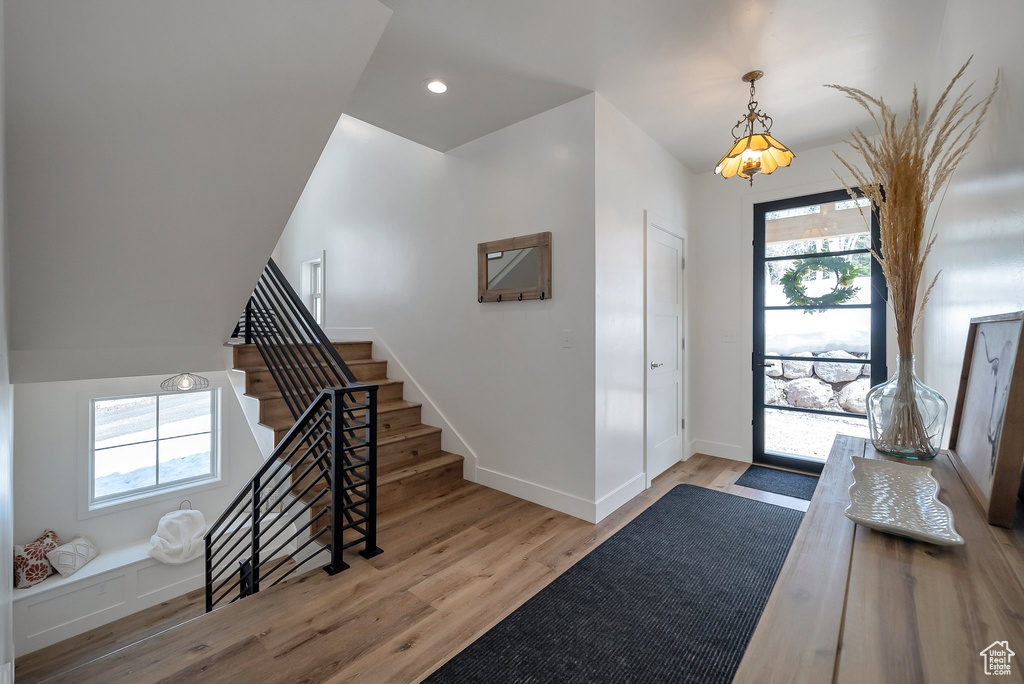 Foyer entrance featuring recessed lighting, light wood finished floors, stairs, and baseboards