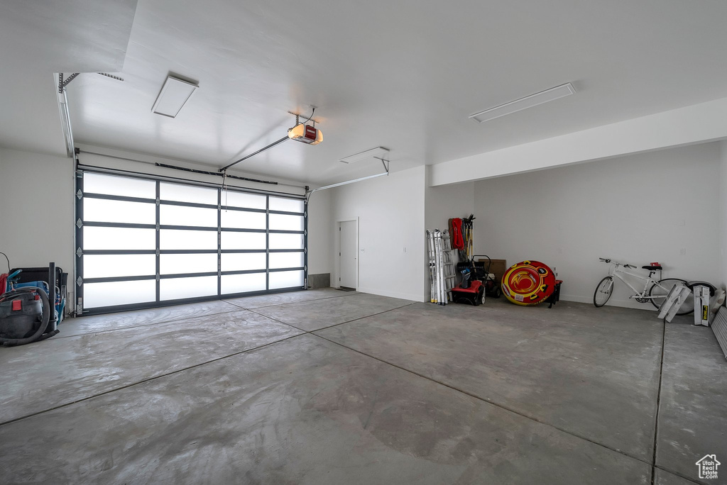Garage featuring a garage door opener