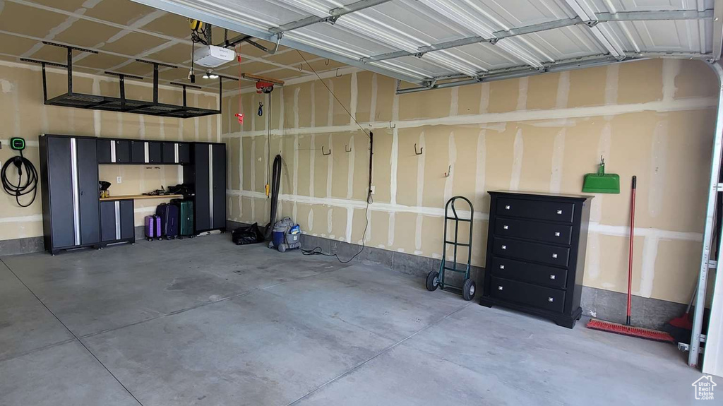 Garage featuring a garage door opener