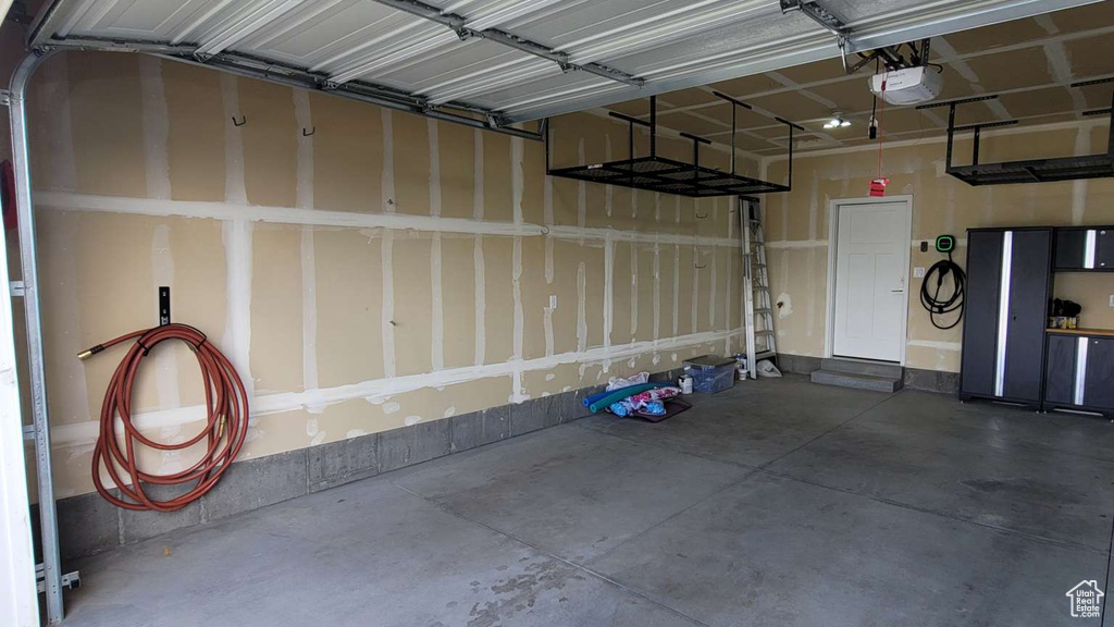 Garage featuring a garage door opener
