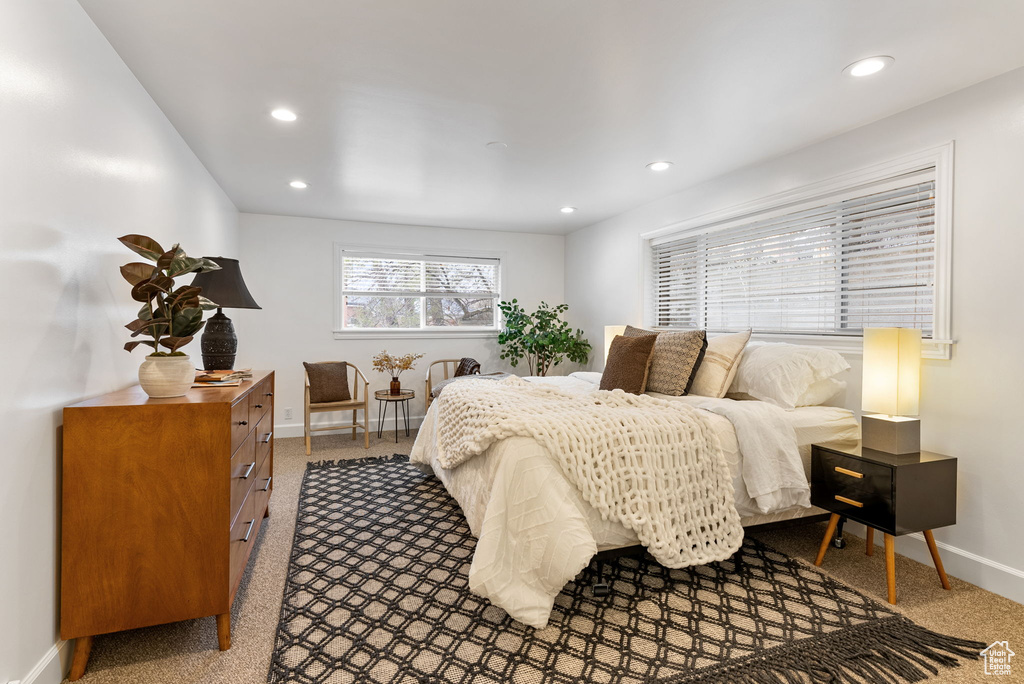 Carpeted bedroom featuring baseboards and recessed lighting