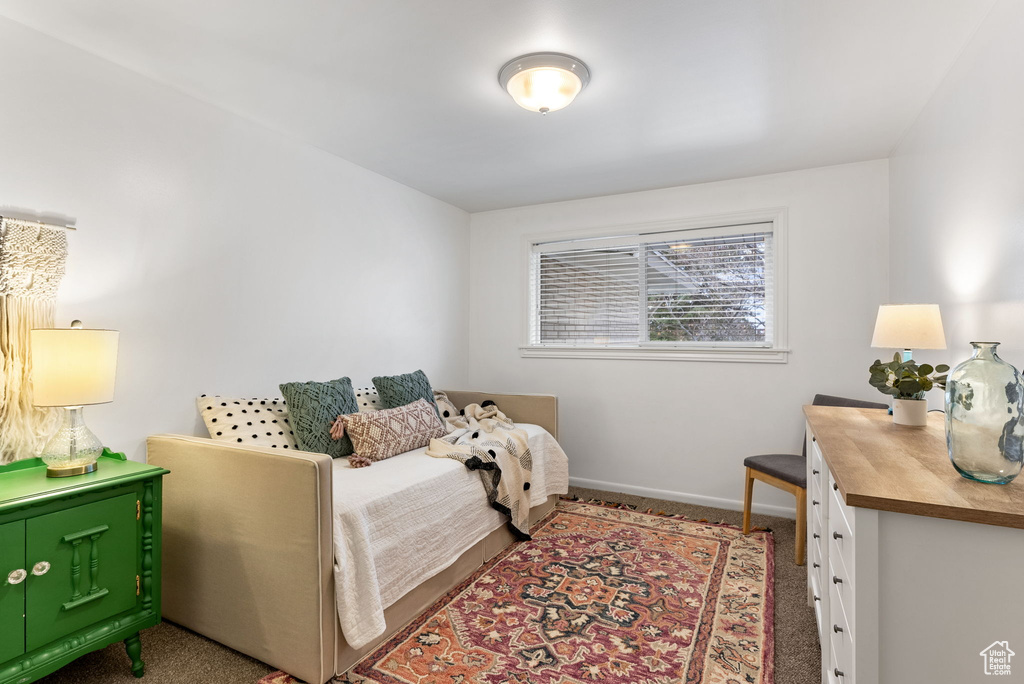 Bedroom with carpet floors and baseboards