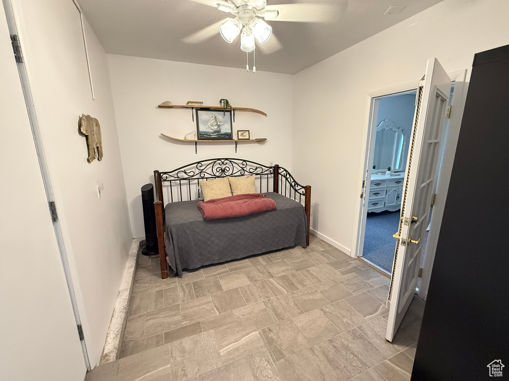 Bedroom featuring baseboards and ceiling fan