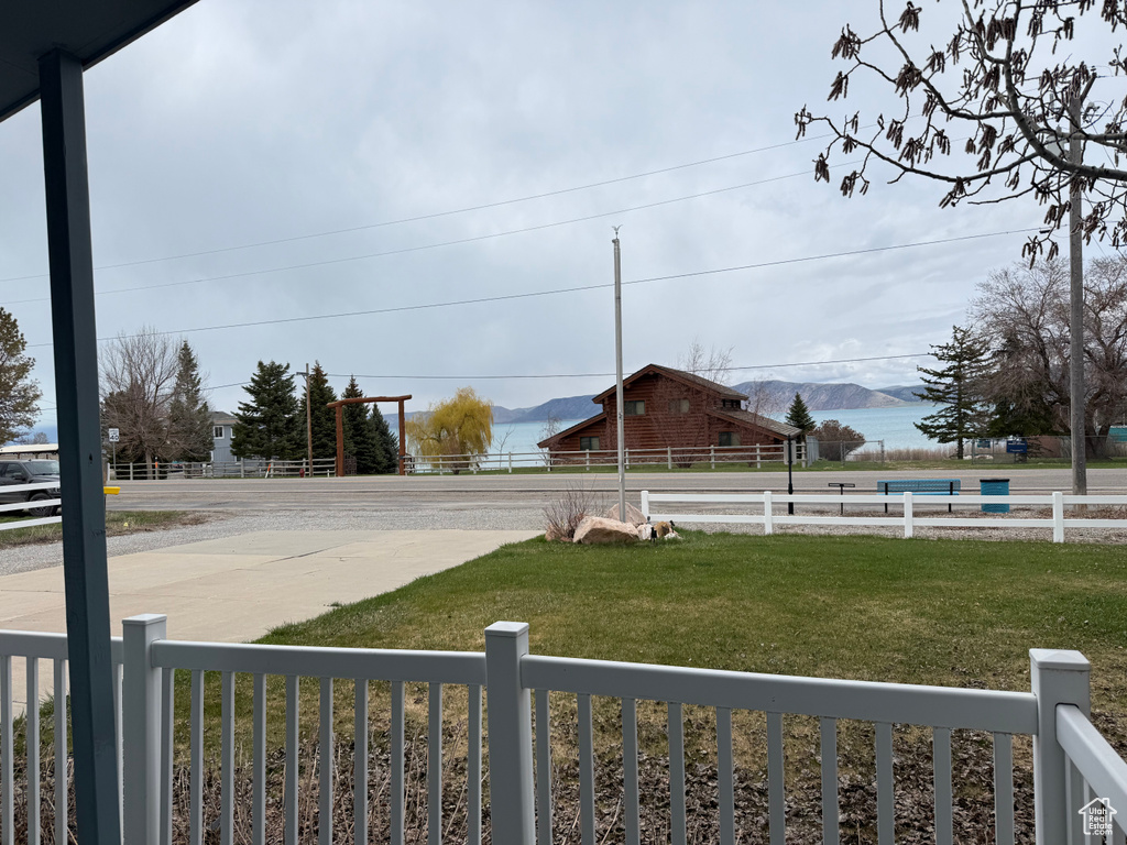 View of yard featuring a mountain view and fence