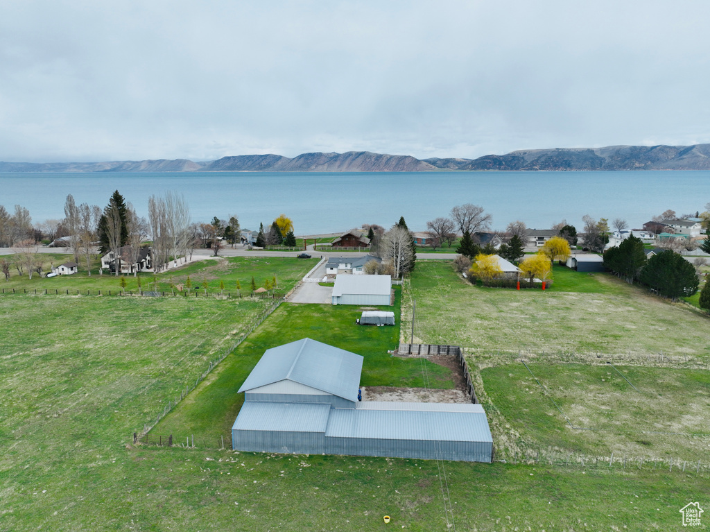 Drone / aerial view with a water and mountain view