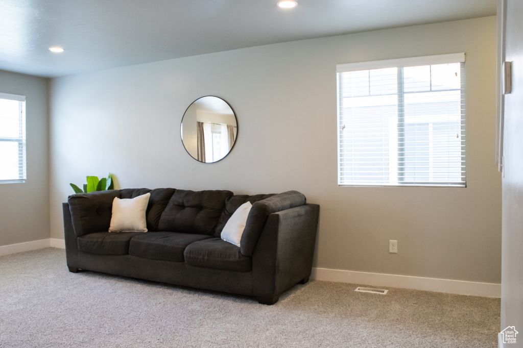 Living area featuring carpet floors and recessed lighting