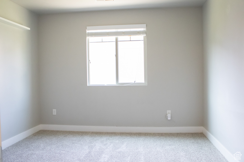 Spare room featuring carpet floors