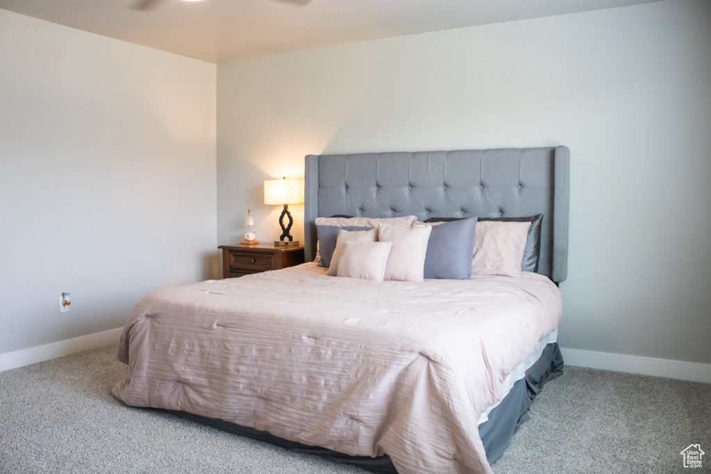 Bedroom with carpet flooring and baseboards