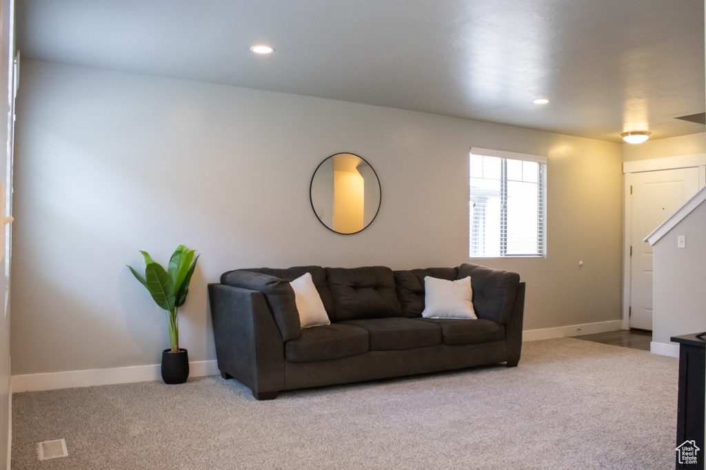 Carpeted living area featuring recessed lighting
