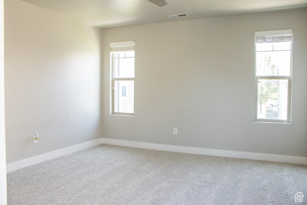 Unfurnished room with carpet floors and ceiling fan