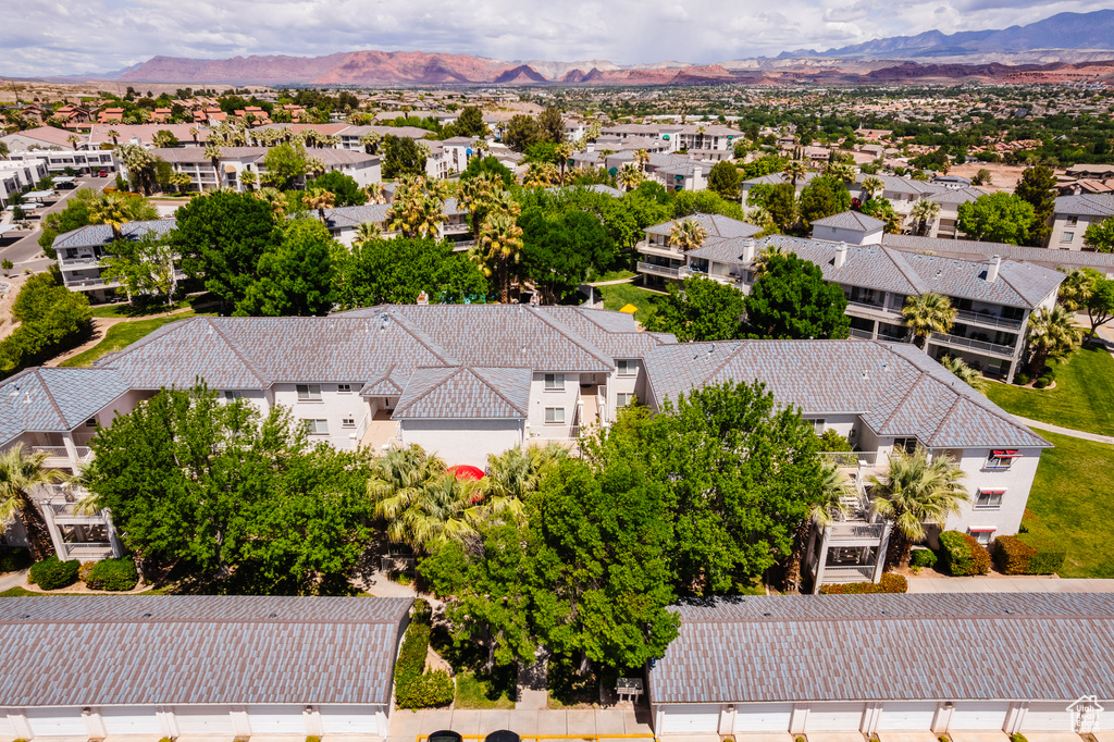 Birds eye view of property with a mountain view and a residential view