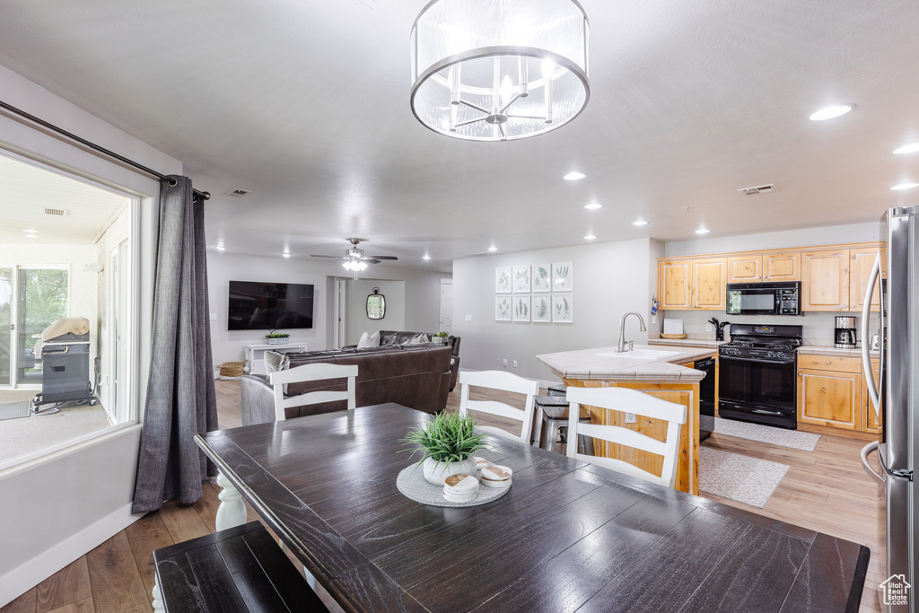 Dining space with baseboards, recessed lighting, light wood-style flooring, and visible vents