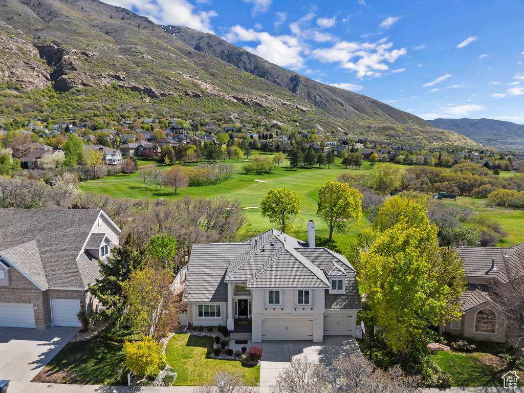 Birds eye view of property with a mountain view and a residential view