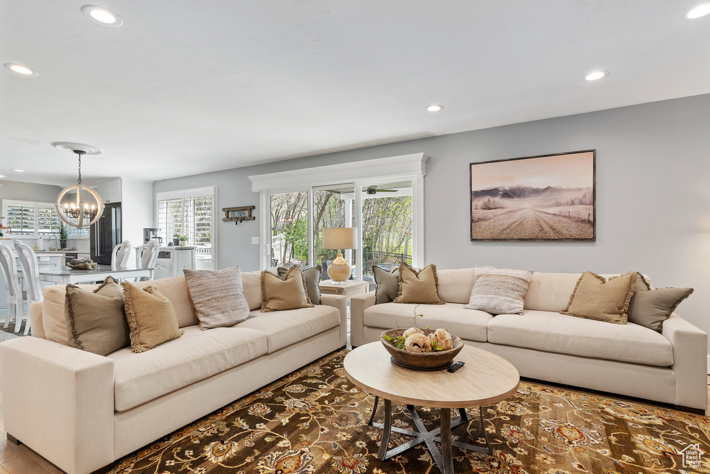 Living area featuring a chandelier and recessed lighting